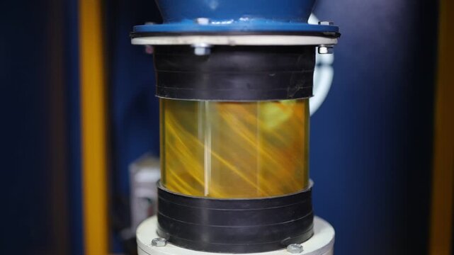 Turmeric powder grinding in a machine, slow motion scene for a corporate film in a factory, haldi powder 