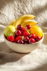 A vibrant bowl overflowing with fresh ripe strawberries cherries bananas and apples bathed in soft sunlight