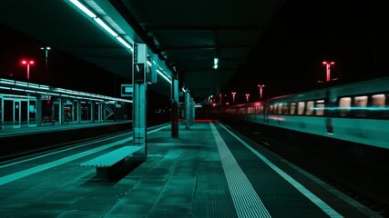 Moody nighttime view of a deserted train station platform with a moving train, illuminated by teal and red lights, urban travel concept. - Powered by Adobe