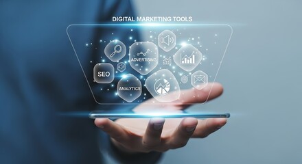 Fototapeta premium Hand holding a phone displaying digital marketing tools in a holographic interface