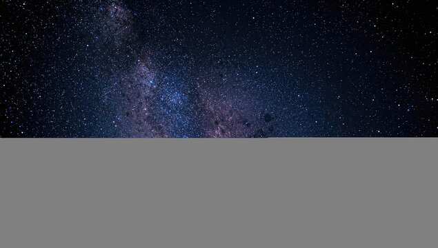 Closeup of the Milky Way galaxy featuring stars and cosmic dust, showcasing the vastness of space