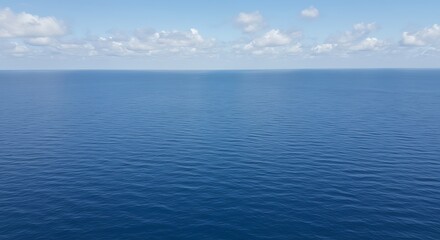 Vast Blue Ocean and Clear Sky Horizon on a Calm Day.