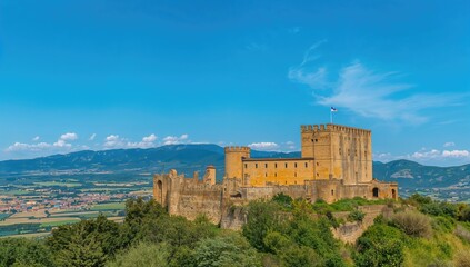 Castle of Belmonte with blue sky, showcasing architectural features and landscape, travel attraction