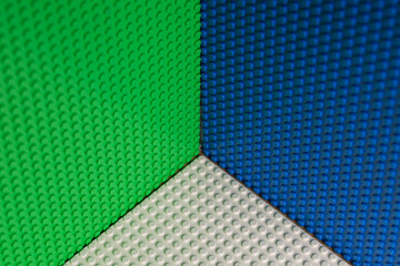 Obraz premium Abstract Green Blue White LEGO Plates Corner Geometric Background