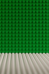 Naklejka premium Green and White LEGO Baseplates Building Background Perspective