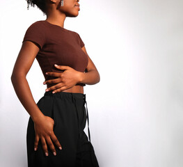 Nude beige manicured nails of afro woman in studio, copy space