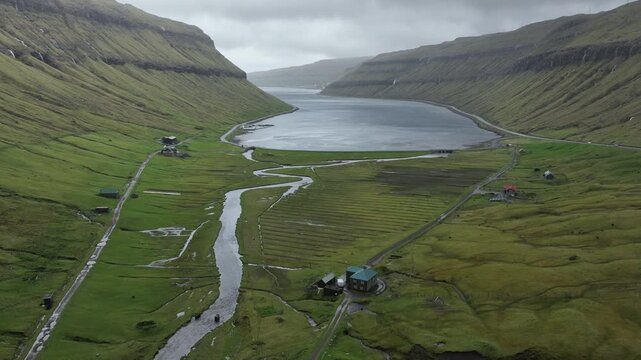 Stunning aerial footage of the remote and picturesque village of Saksun on a cloudy day