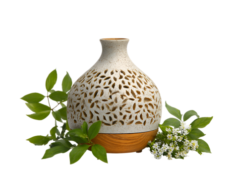 Decorative ceramic vase with intricate leaf pattern and green foliage isolated on transparent background