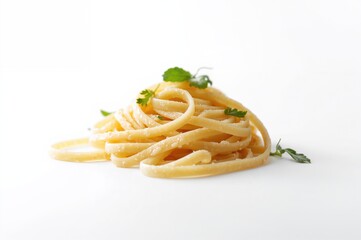 Nest-shaped fettuccine pasta displayed against a white backdrop, close-up view.