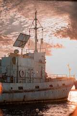 Fototapeta premium Abandoned Rusty Mystical Ship at Sunset