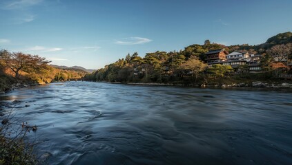 Obraz premium Kamo River flowing through a serene landscape, seasonal change