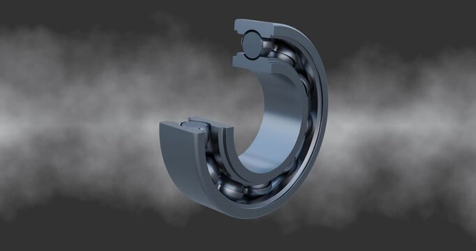 Close up view of a single row, deep groove ball bearing with a cross sectional view of the inner race, outer race and steel cage 