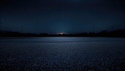 Fototapeta premium Dark Concrete Street Surface Beneath the Horizontal Night Sky, urban density