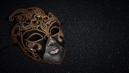Luxury mask on dark glitter background, a festive accessory for a carnival celebration