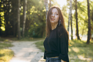 A young teenage girl enjoys a sunny morning in the park.