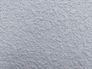 Elegant white stucco wall texture ideal for modern backgrounds offering a clean and versatile style