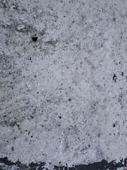 A high-resolution photograph capturing the seamless texture of a decorative stone wall. This contemporary, rugged texture is ideal for use as a modern architectural backdrop 