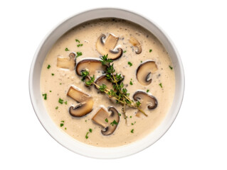 Bowl of creamy mushroom soup with sliced mushrooms and fresh dill garnish, served in dark ceramic bowl, top view, isolated on transparent background. Comfort food