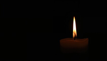Flickering candle illuminating a dark backdrop, creating a solemn atmosphere, Funeral Candles