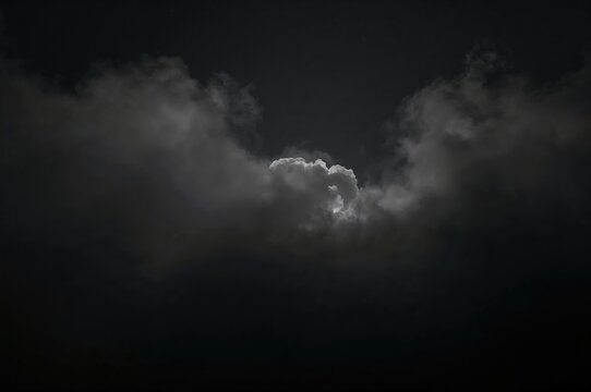Fog formed by smoke clouds envelops the upper left and lower right corners of the backdrop