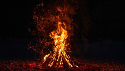 A vibrant flame from a large bonfire in a snowy woodland, emphasizing warmth during winter