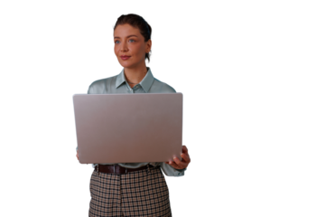 Young businesswoman holding a laptop, standing and looking away, thinking about innovation and future business strategies