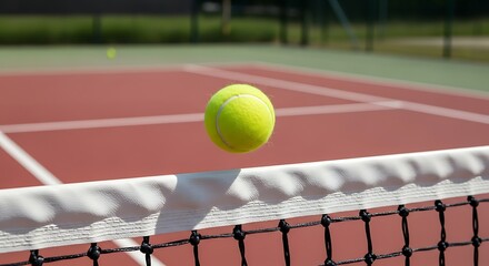 Tennis Ball Over Net - A Moment of Precision and Focus.