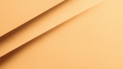 Smooth textured orange paper with layered diagonal folds creating an aesthetic background for design, art, or creative projects in warm tones