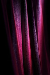 Deep crimson violet light streaks with velvet texture on black background, luxury brand portrait and packaging design marketing visual

