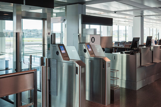 Automated airport gate at modern airport for scanning boarding pass. Concept of digitalization, self-check-in and independent travel.