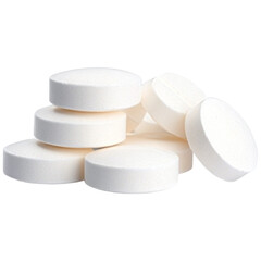 White round pills stacked, medicine, healthcare, isolated on white.