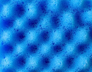 Close-up macro view of vibrant blue sponge texture. Highly detailed porous material