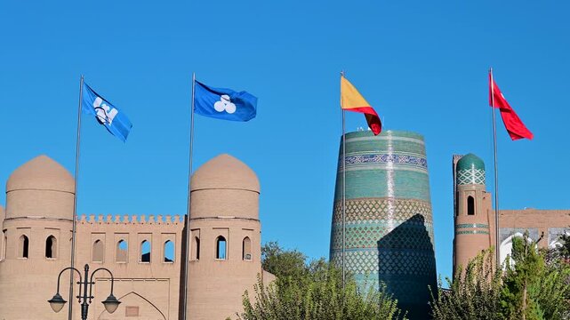Flags waving outside the city gates of Khiva, Uzbekistan