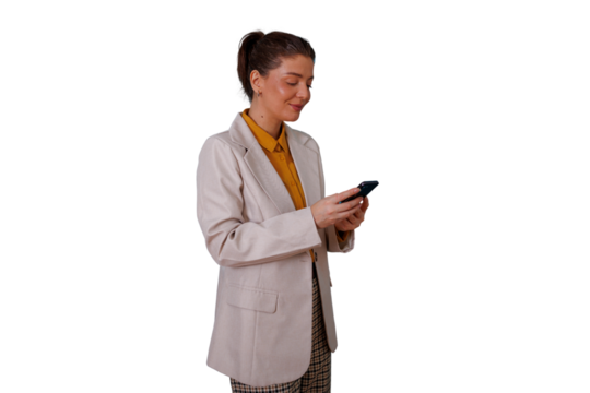 Businesswoman using mobile phone for messaging and networking, smiling with professional confidence