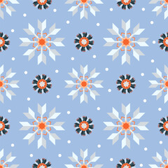 A seamless winter snowflake pattern with a modern geometric design in festive blue, white, and orange for textiles