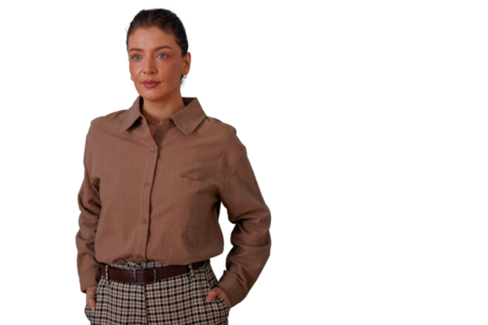 Confident young woman standing with hands in pockets, posing for business casual portrait on transparent background