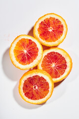 four slices of sanguini on a white background