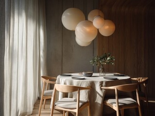 A table with a white tablecloth and a vase of green leaves. There are four chairs around the table