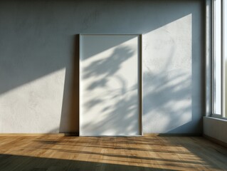 A large white framed picture is hanging on the wall in a room. The picture is centered on the wall and is the focal point of the space. The room has a wooden floor