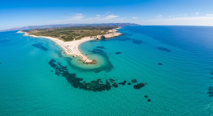 Obraz premium Aerial view of a stunning turquoise sea and a beautiful island with sandy beaches.