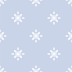 Minimalist vector seamless pattern with floral ethnic motif. Modern geometric ornament. Abstract blue and white background texture with simple flower silhouettes, stylized snowflakes. Repeated design