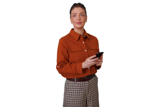 Woman standing holding smartphone, engaging with mobile technology, browsing content, transparent background