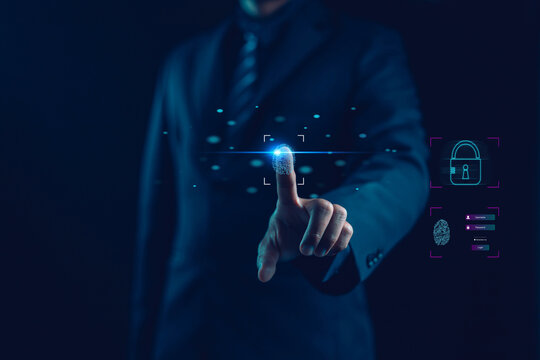 Businessman using fingerprint scanning for digital security access and identity authentication, representing cybersecurity, privacy protection, and technology innovation concept.