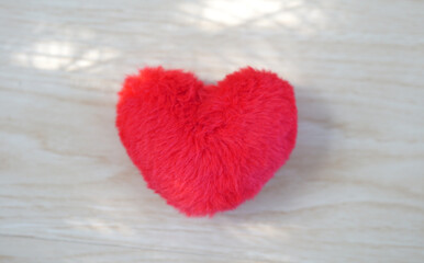 Red Fluffy Heart on Wooden Background