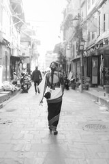 Newari Girl in Traditional Attire Strolling Through Patan Durbar Square