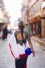 Newari Girl in Traditional Attire Strolling Through Patan Durbar Square