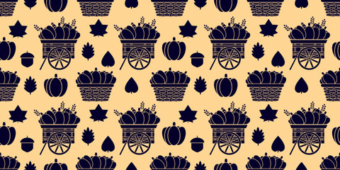 Flat blue silhouette seamless pattern with wagon, basket of pumpkins, and autumn leaves on beige background. Great for rustic Thanksgiving textile and wrapping designs.