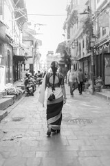Newari Girl in Traditional Attire Strolling Through Patan Durbar Square