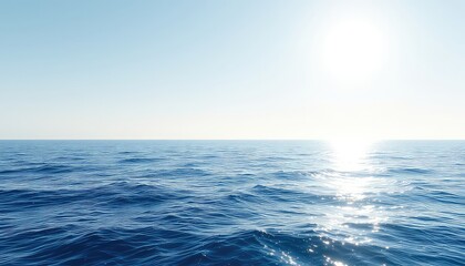 Obraz premium Vast expanse of serene blue ocean under a clear sky, sunlight dancing on the surface of the water creating a mesmerizing and peaceful scene