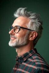 Obraz premium Elegant men's quiff haircut - midlife white man with grey hair.